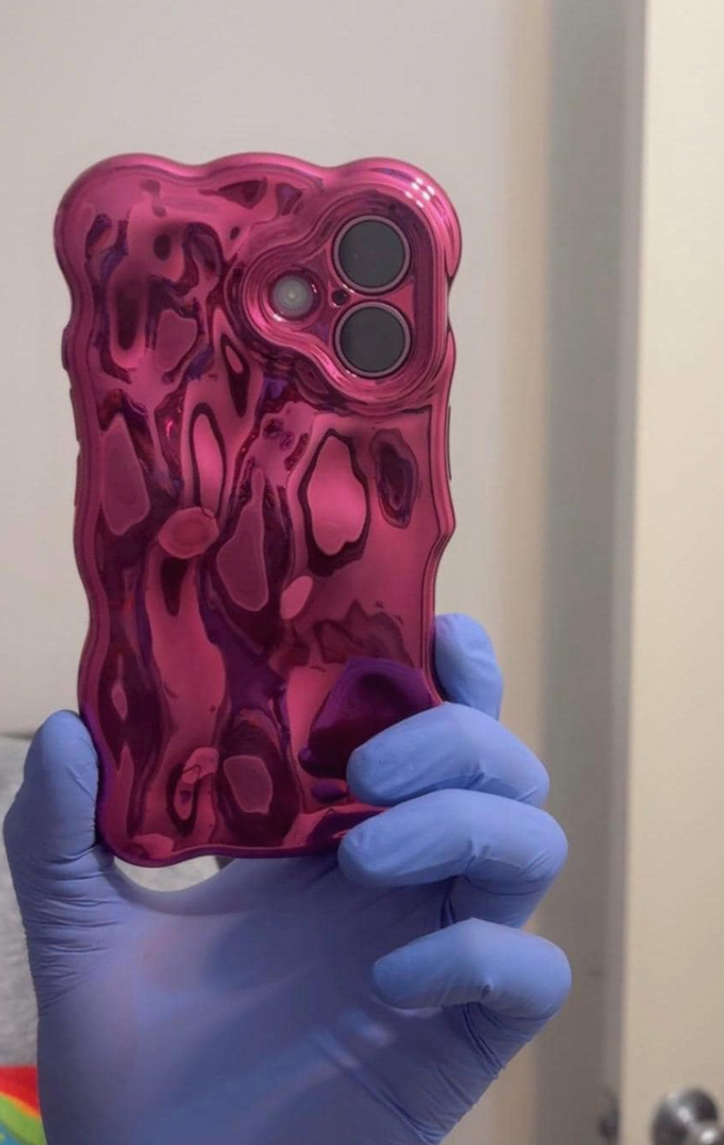 Chrome style iPhone case with a metallic finish, pink color.